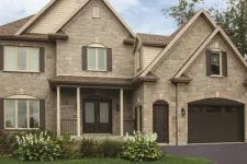 This is a Prestige XL design garage door, here shown in single size, Chocolate Walnut color, with Pinhead windows.